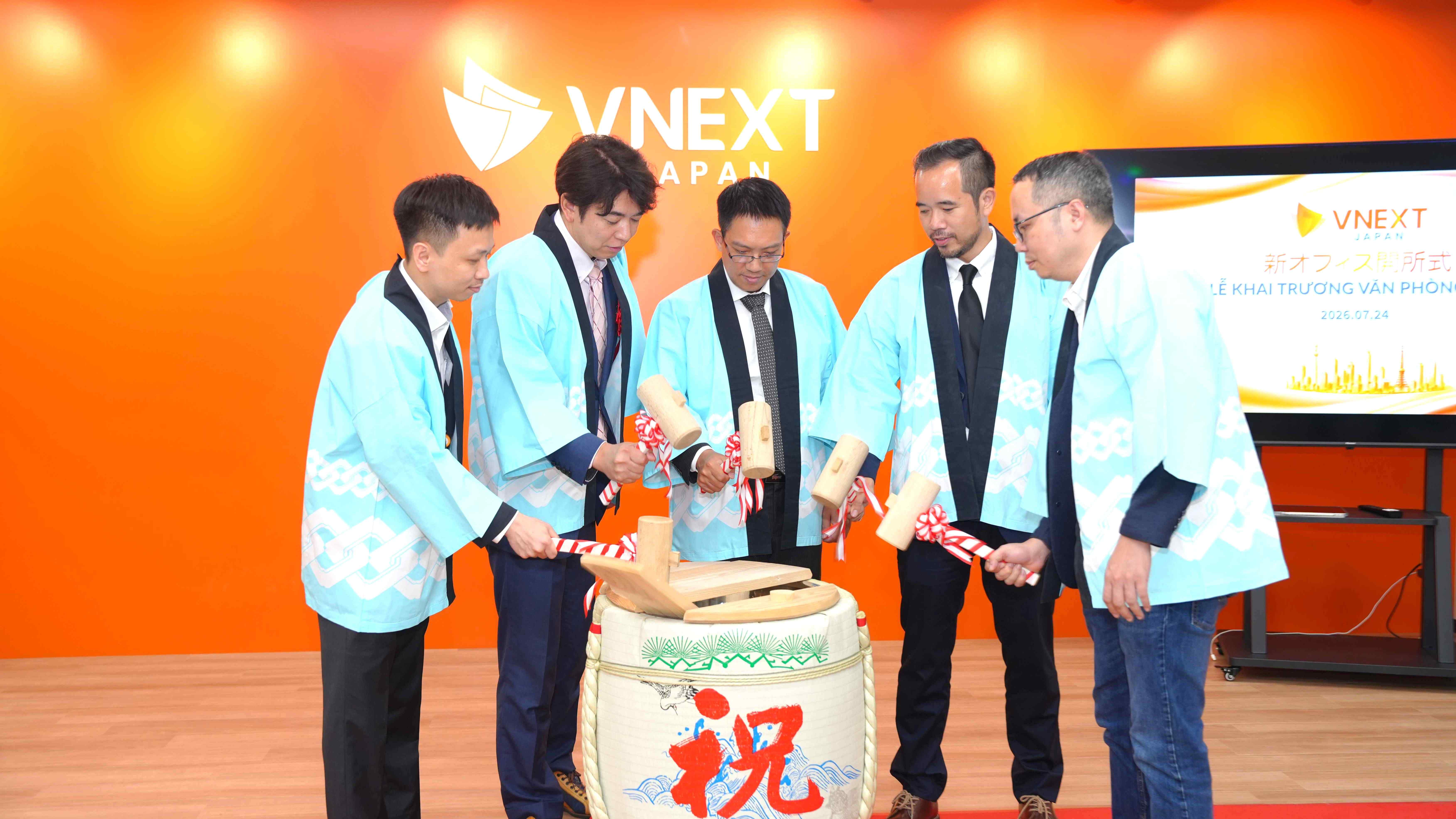 VNEXT JAPAN leadership breaking open a sake barrel in the traditional Kagami Biraki ceremony at the Tokyo office opening